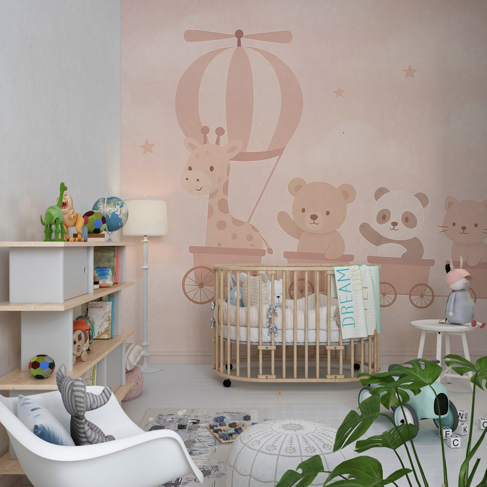 Soft pink animal adventure wallpaper creating peaceful atmosphere in baby's bedroom decor