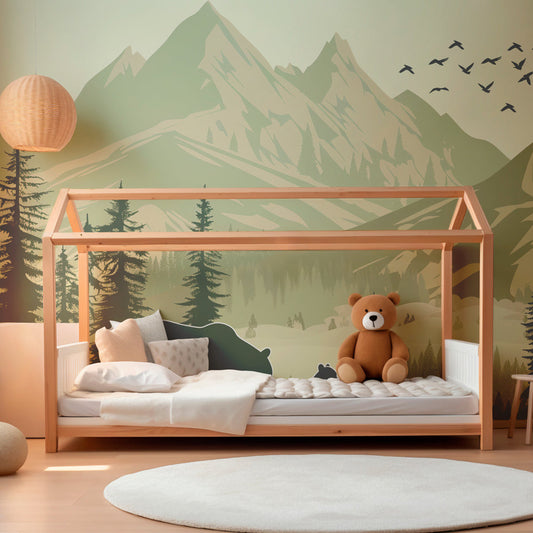 Kids-Mundo bear and cub silhouette mural behind a bed in a woodland kids bedroom.