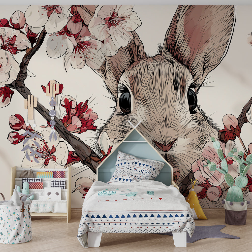 Serene baby room featuring cherry blossom rabbit wallpaper with soft pastel decor