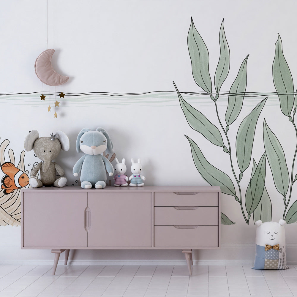 Ocean themed kids bedroom featuring clownfish mural wallpaper with coral reef design