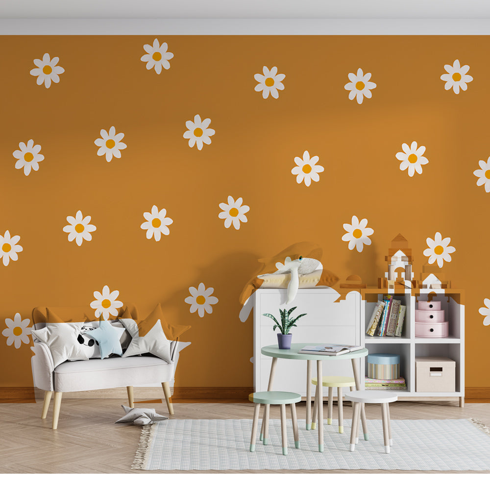 Orange floral wallpaper creating cheerful atmosphere in children's bedroom with natural furniture