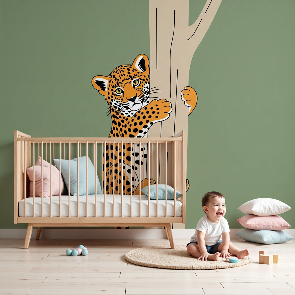 Leopard tree climbing mural wallpaper in modern nursery with natural wood crib by Kids-Mundo