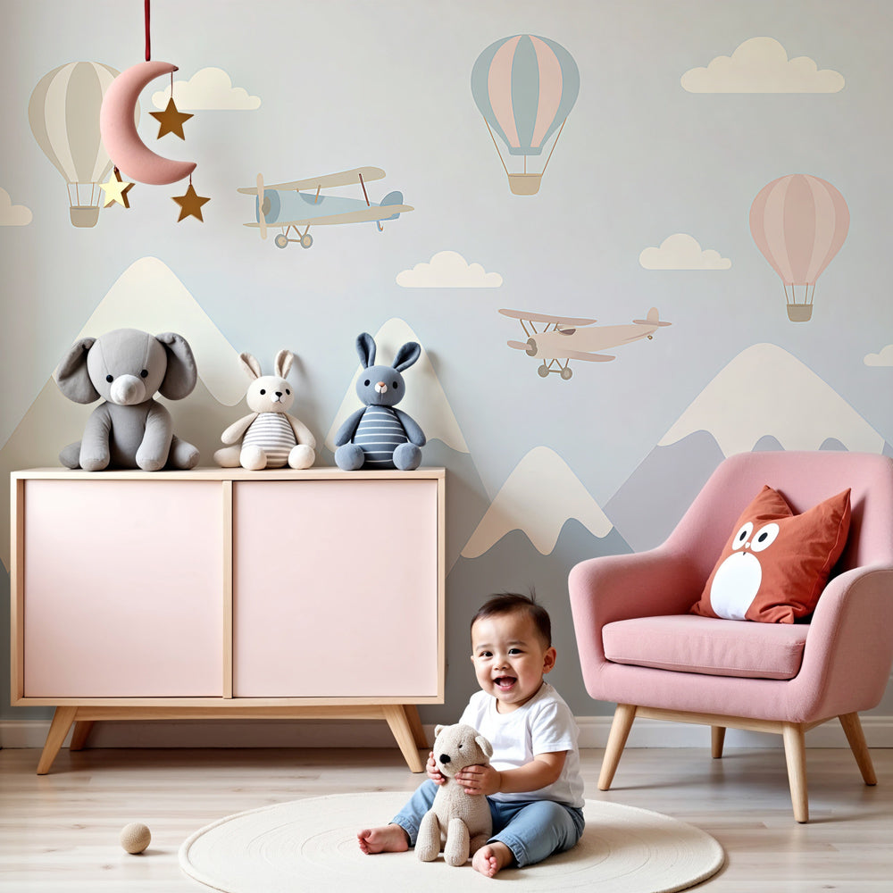 Mountain adventure mural wallpaper with planes and hot air balloons in modern nursery by Kids-Mundo