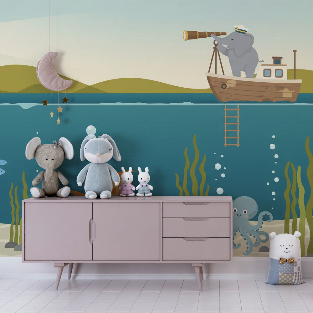 Ocean-themed elephant wallpaper creating nautical kids bedroom decor with boat and lighthouse