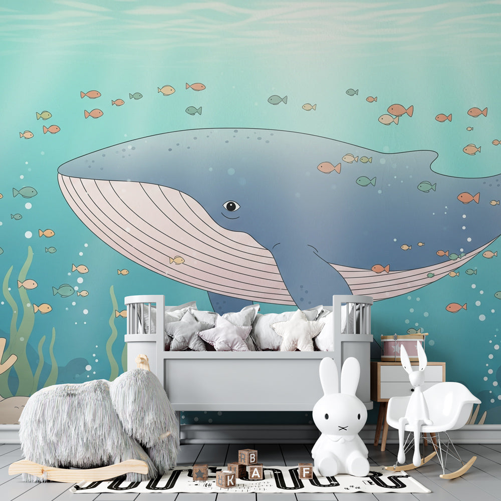 Underwater whale wallpaper creating peaceful marine atmosphere in children's bedroom