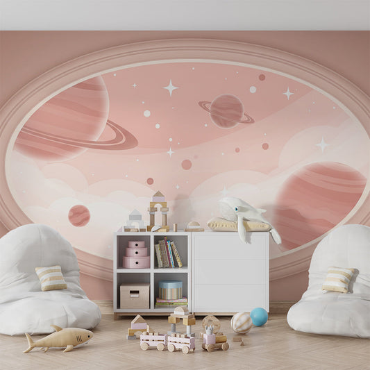 Kids-Mundo ringed planet oval mural behind a bed in a child's pink bedroom.