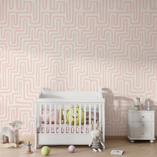 Kids-Mundo pink maze pattern wall mural shown on a kids bedroom wall above a bed.