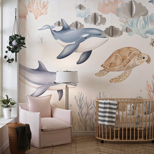 Kids-Mundo whale wall mural behind a bed in a soft pastel kids bedroom