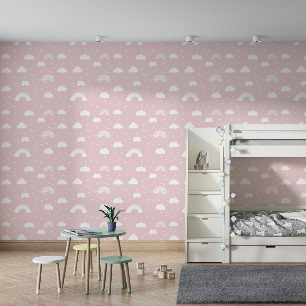 Pink rainbow and cloud wallpaper creating dreamy atmosphere in children's bedroom