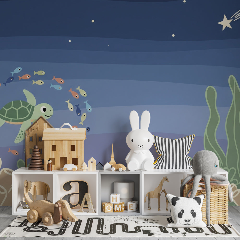 Ocean themed mural wallpaper with turtle and fish in peaceful blue kids bedroom setting