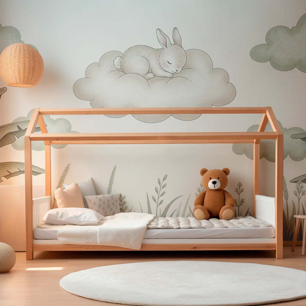 Cloud bunny wallpaper creating serene atmosphere in modern baby bedroom with natural decor