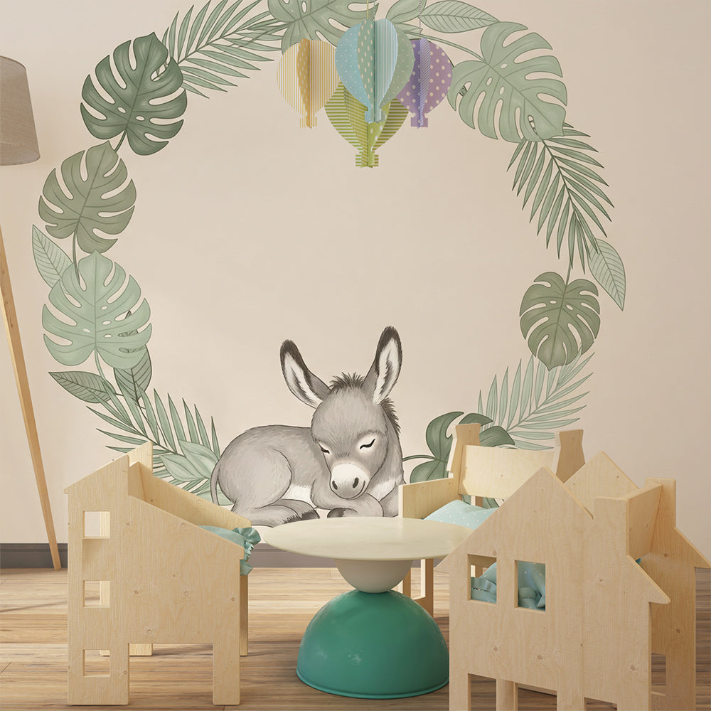 Tropical animal nursery wallpaper featuring sleeping donkey with monstera leaves for baby room decor