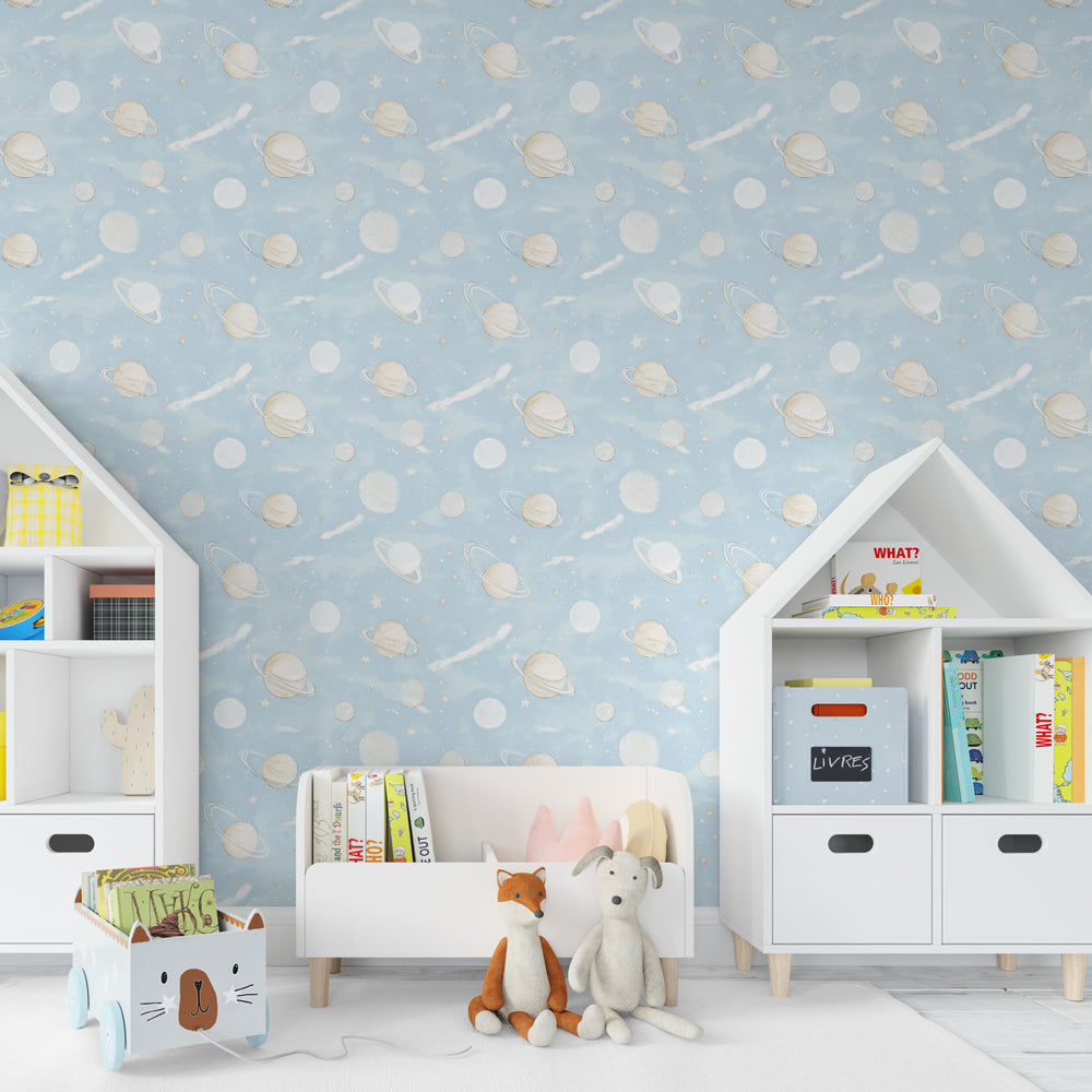 Cosmic themed children's bedroom featuring space galaxy mural wallpaper with blue background