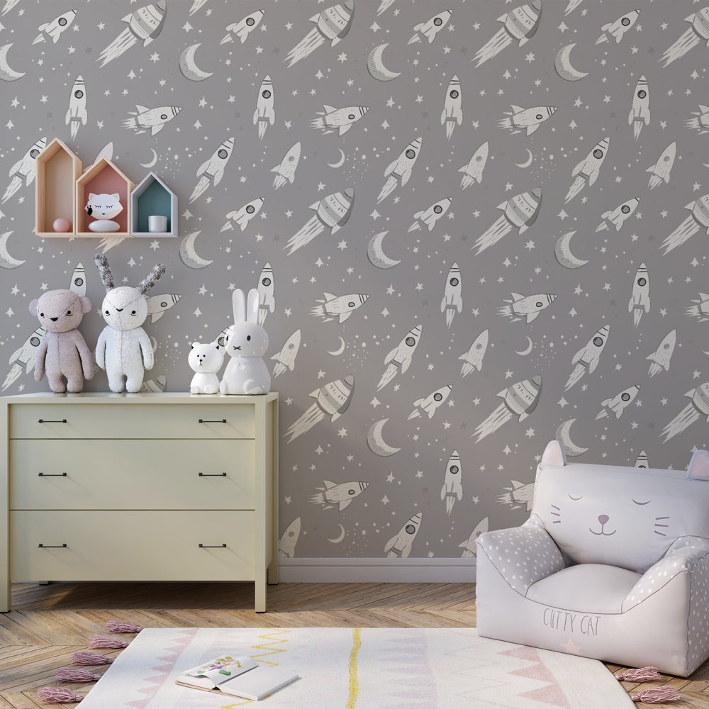 Cosmic rocket wallpaper creating magical space-themed children's bedroom atmosphere