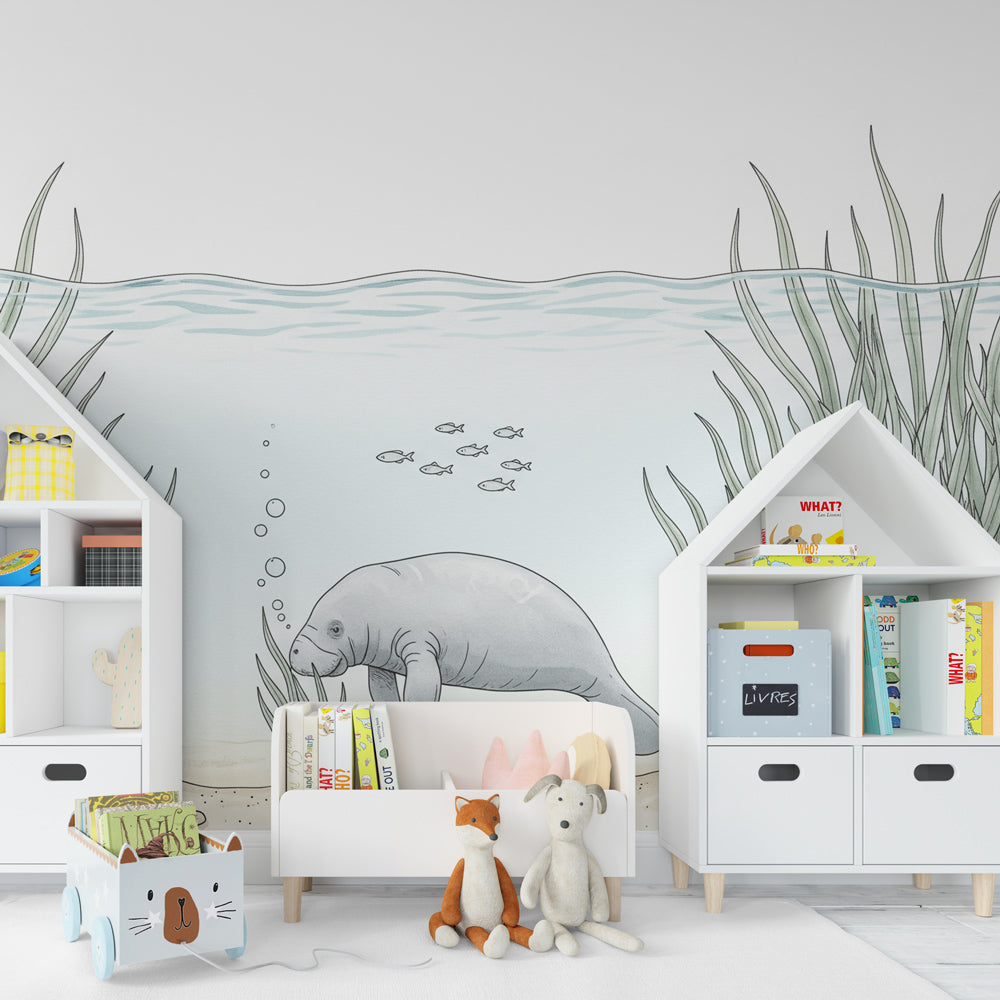 Ocean adventure mural wallpaper with manatee and seagrass in modern kids bedroom setting
