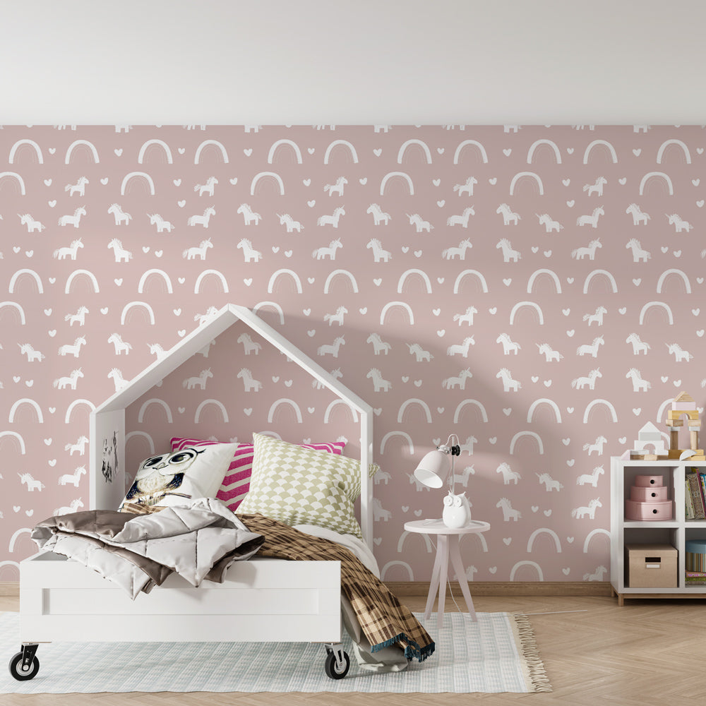 Magical unicorn rainbow wallpaper creating dreamy children's bedroom decor with pink tones