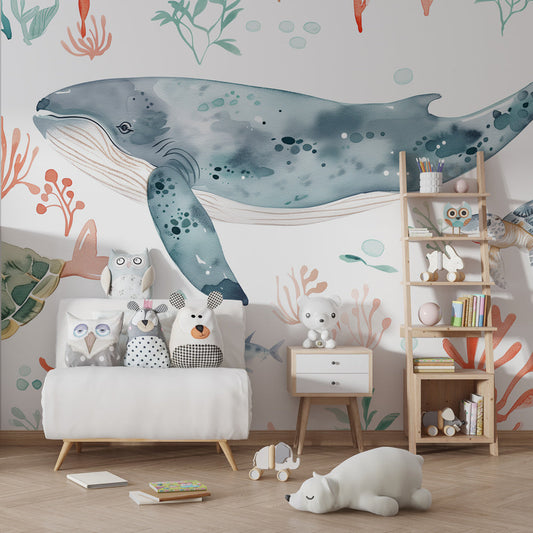 Kids-Mundo whale and turtle wall mural behind a bed in a soft kids bedroom