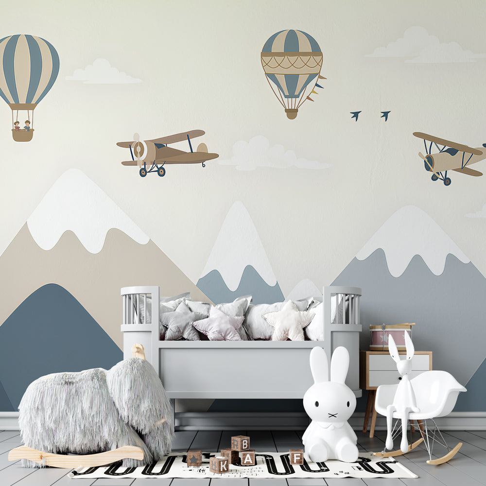 Mountain and balloon wallpaper creating adventurous kids bedroom atmosphere
