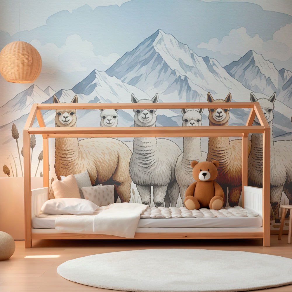 Mountain alpaca mural wallpaper creating cozy reading corner in children's playroom