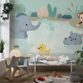 Animal mural wallpaper installed in bright children's playroom with safari pond theme