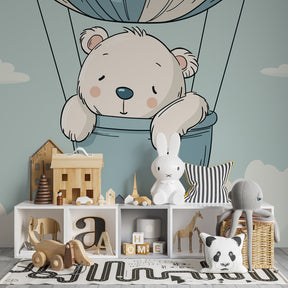 Dreamy bear balloon wallpaper creating peaceful nursery decor with pastel blue clouds