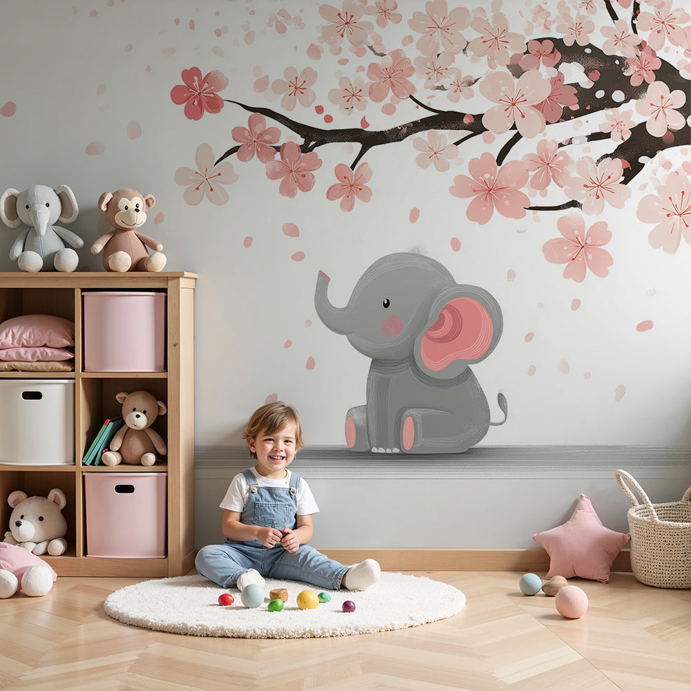 Kids-Mundo baby elephant cherry blossom wall mural styled behind a cot in a soft pink nursery