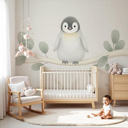 Kids-Mundo baby penguin wall mural on a branch, styled in a calm neutral nursery with a cot.