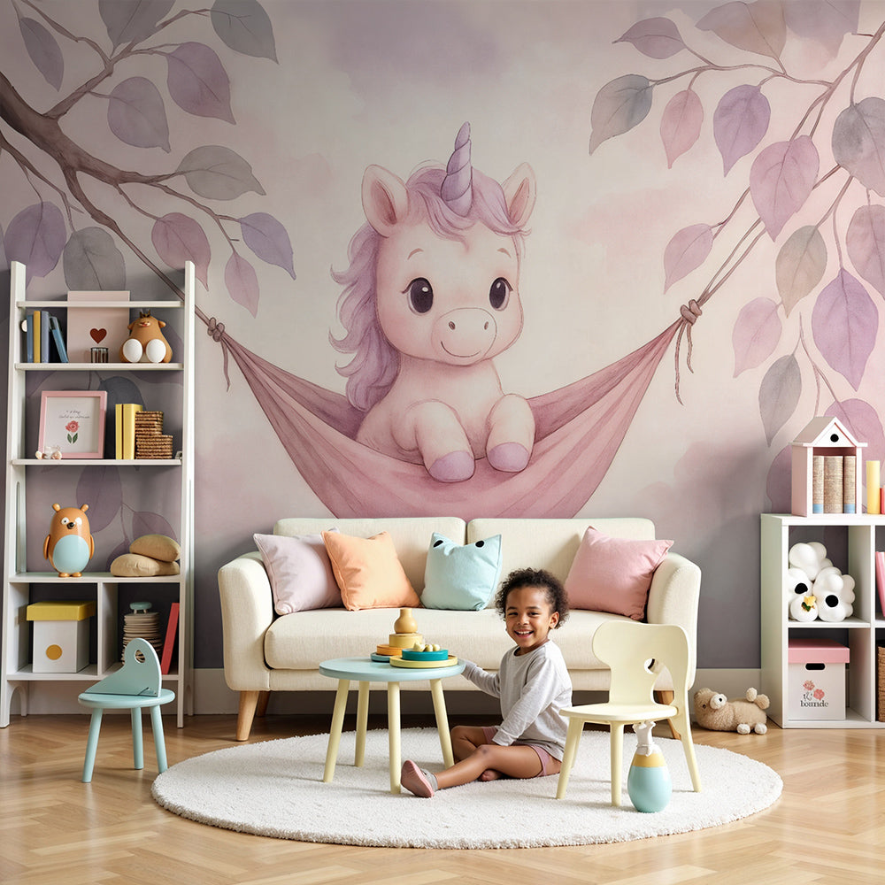 Kids-Mundo baby unicorn hammock wall mural styled in a soft pastel nursery with a cot