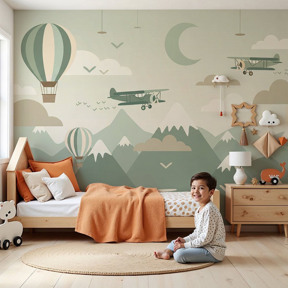 Kids-Mundo hot air balloon mobile wall mural above a cot in a soft green nursery