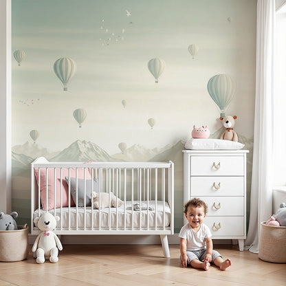 Kids-Mundo hot air balloon wall mural drifting over misty mountains in a soft nursery