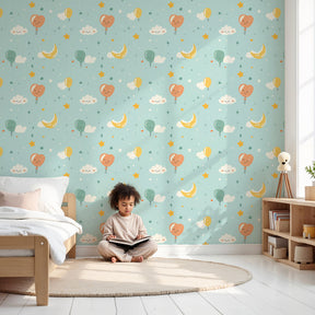 Happy balloon faces mural wallpaper creating magical nursery decor with pastel colors by Kids-Mundo