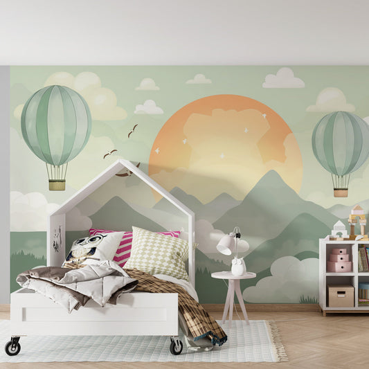 Kids-Mundo mountain sunrise wall mural with striped balloons shown in a kids' bedroom
