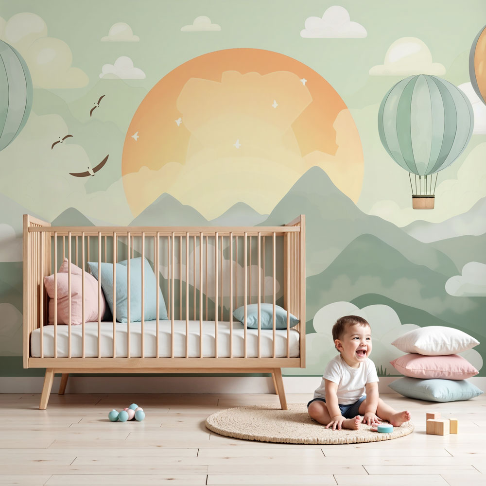 Kids-Mundo hot air balloon wall mural with a sunrise over mountains styled in a nursery
