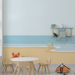 Coastal themed mural wallpaper for children's playroom featuring cute crab on sandy beach by Kids-Mundo