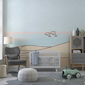 Gentle dunes and dolphins wallpaper transforming modern baby bedroom into seaside retreat