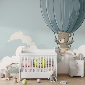 Hot air balloon bear mural wallpaper transforming children's room into magical sky scene