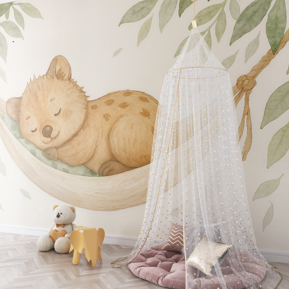 Forest themed bear cub wallpaper with green foliage accent wall in kids room by Kids-Mundo