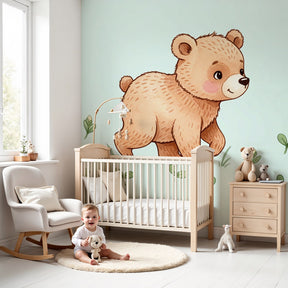 Bear cub nature mural wallpaper in serene baby nursery with wooden crib by Kids-Mundo