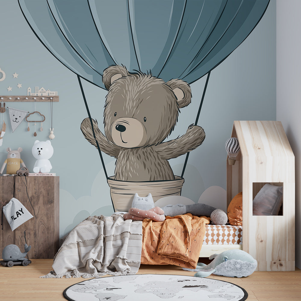 Close-up of bear in hot air balloon mural wallpaper showing cloud details for nursery