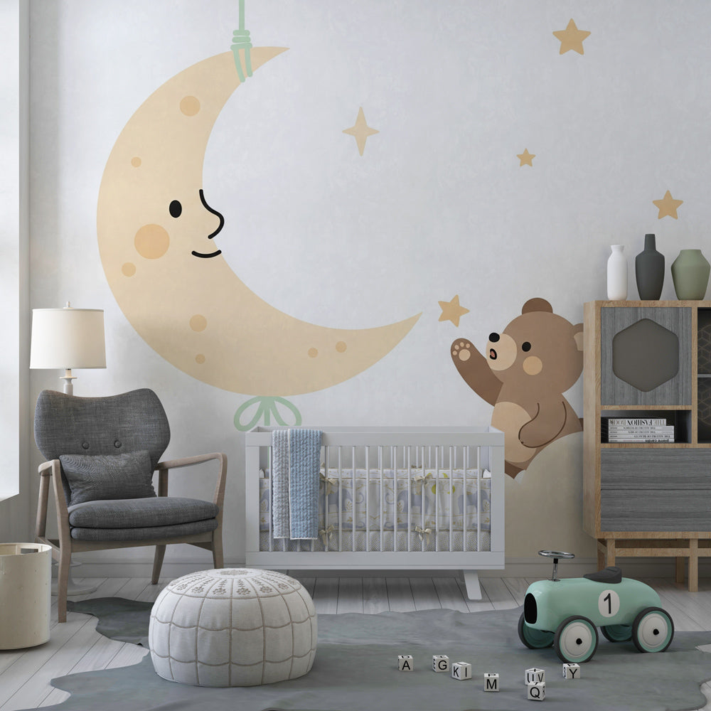 Bear reaching for smiling moon mural wallpaper in soft beige toddler room decor