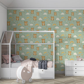 Joyful bear mural wallpaper in children's bedroom with green and blue cloud motifs