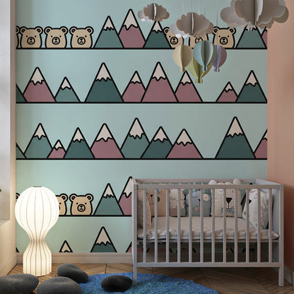Kids-Mundo mountain wall mural brightening a playroom with cheerful bears peeking between snowy peaks.