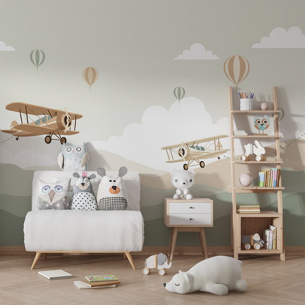 Kids-Mundo biplane wall mural in a playroom with toys and a reading corner