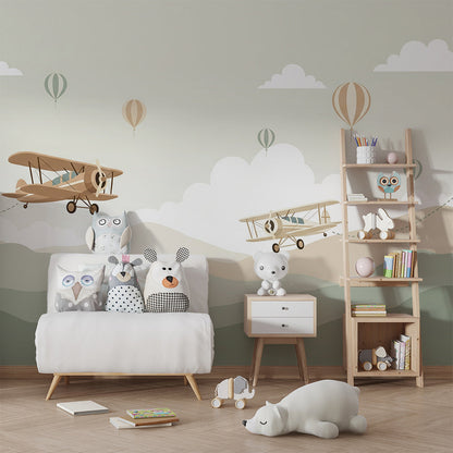 Kids-Mundo biplane wall mural in a playroom with toys and a reading corner