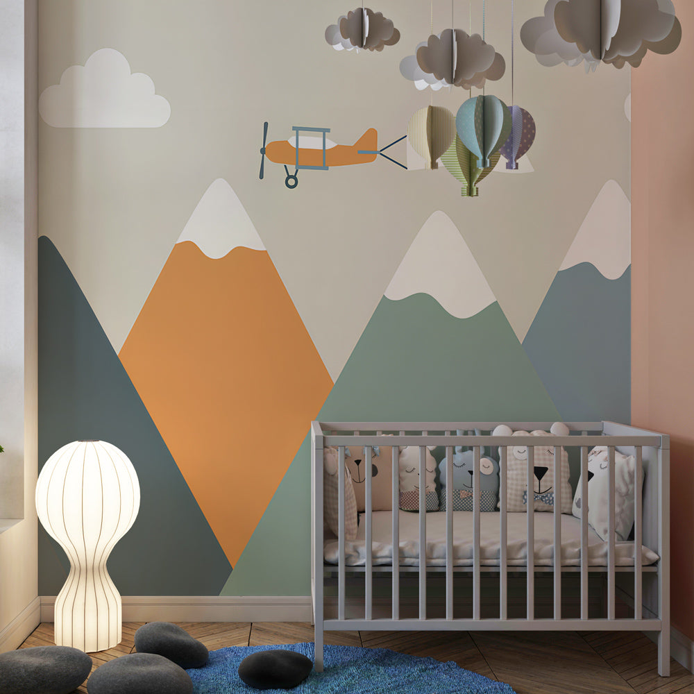 Kids-Mundo mountain wall mural with biplane behind a single bed in a colourful kids bedroom.