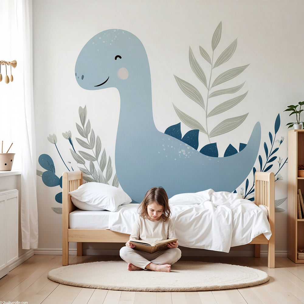 Blue baby dinosaur wall mural by Kids-Mundo styled in a soft pastel nursery with cot and shelving