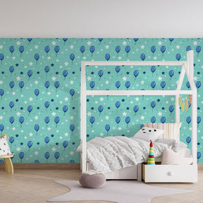 Whimsical blue balloons and stars wallpaper transforming kids playroom by Kids-Mundo