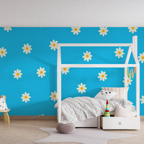Blue and white daisy wallpaper creating nature-inspired playroom atmosphere by Kids-Mundo