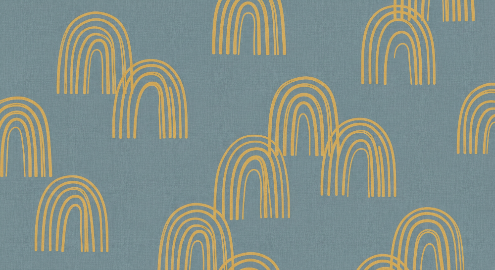 Flat artwork of the Kids-Mundo mustard rainbow arches scattered across a blue linen-look pattern