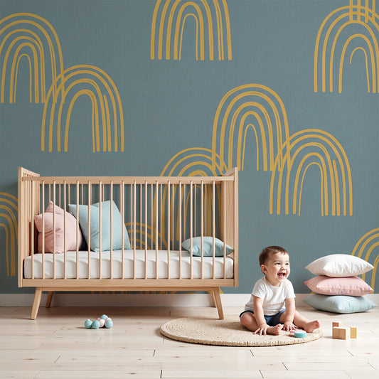 Nursery wall featuring the Kids-Mundo blue linen-look rainbow arch wall mural in mustard tones